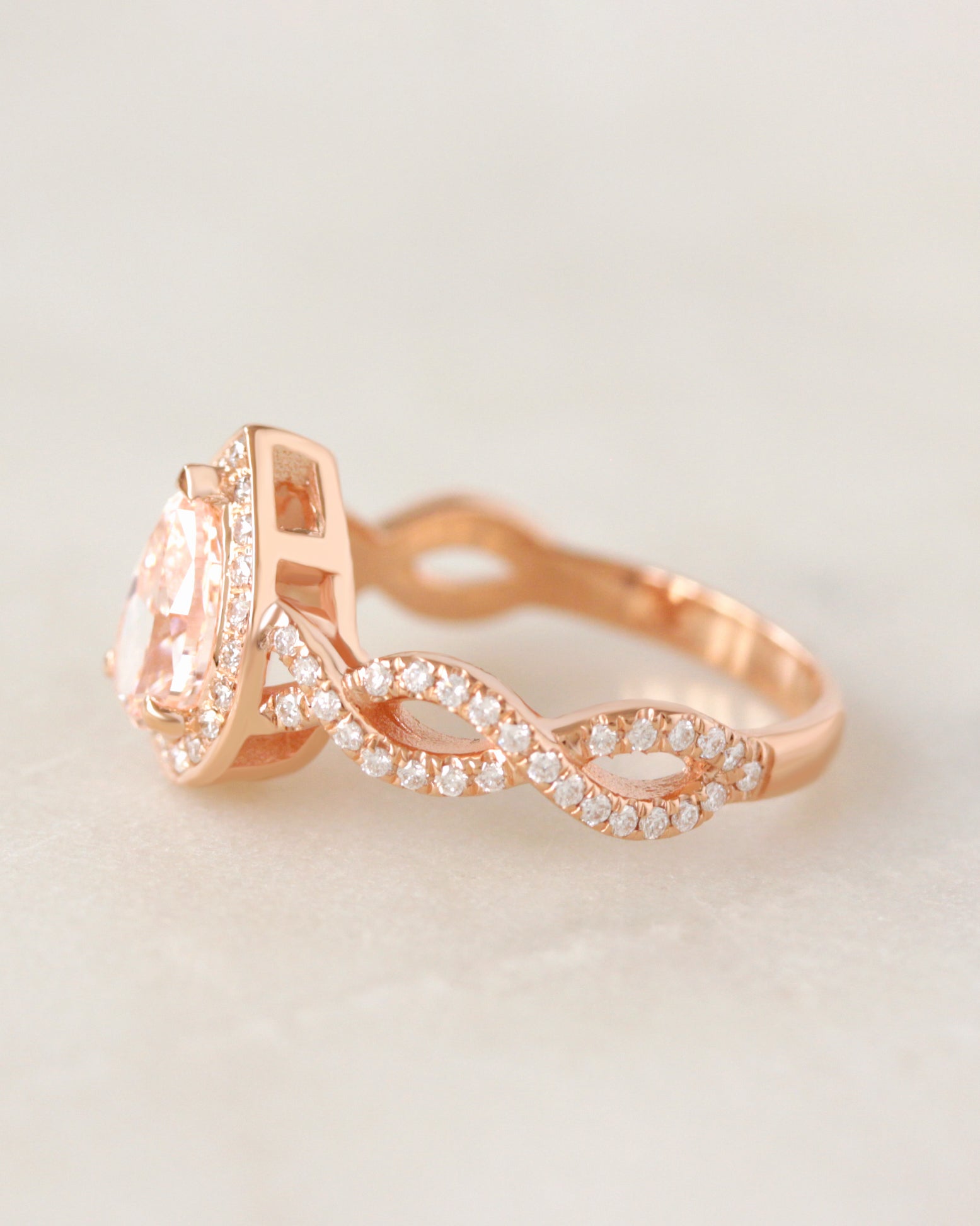 Pear Diamond Halo and Infinity Twist Shank Engagement Ring