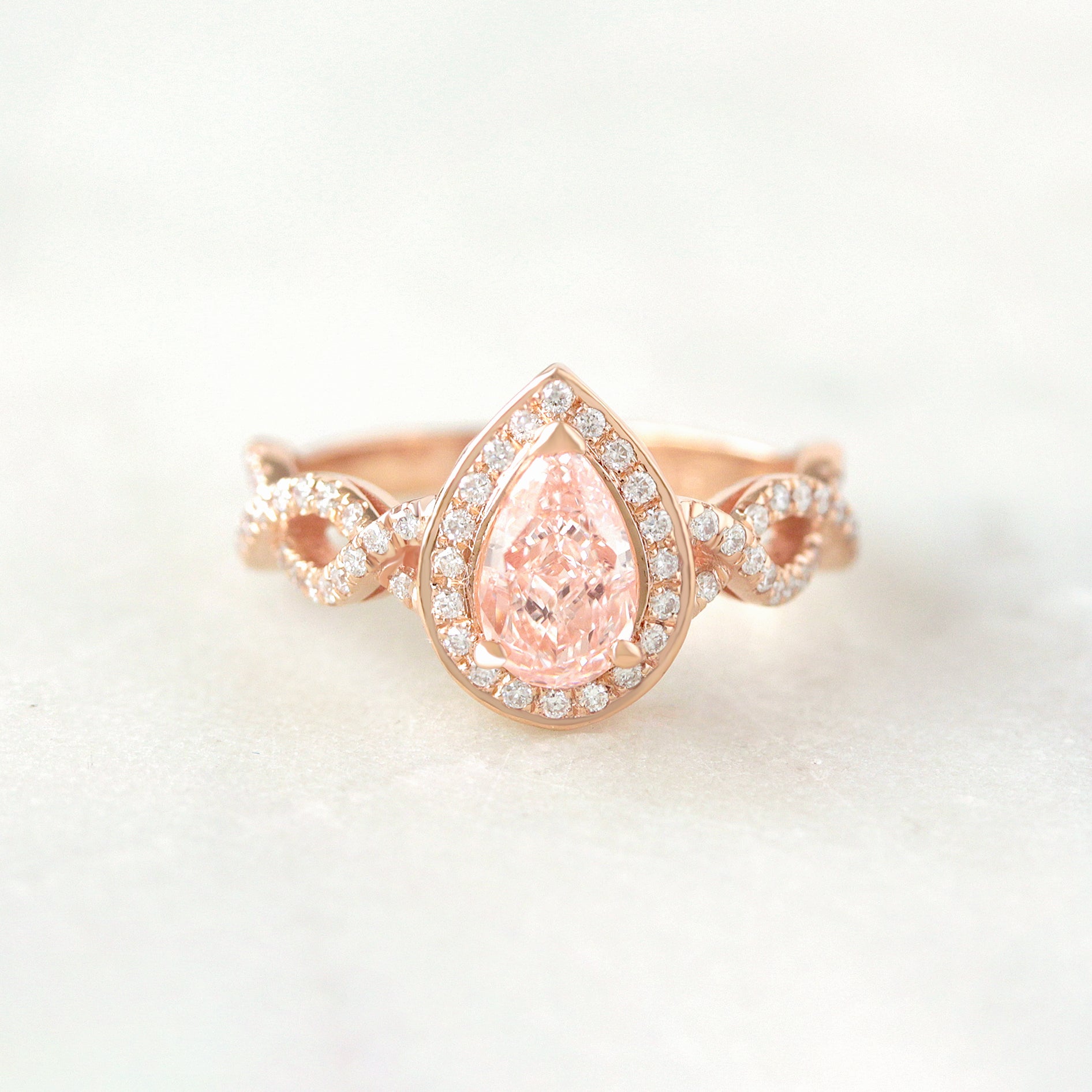 Pear Diamond Halo and Infinity Twist Shank Engagement Ring