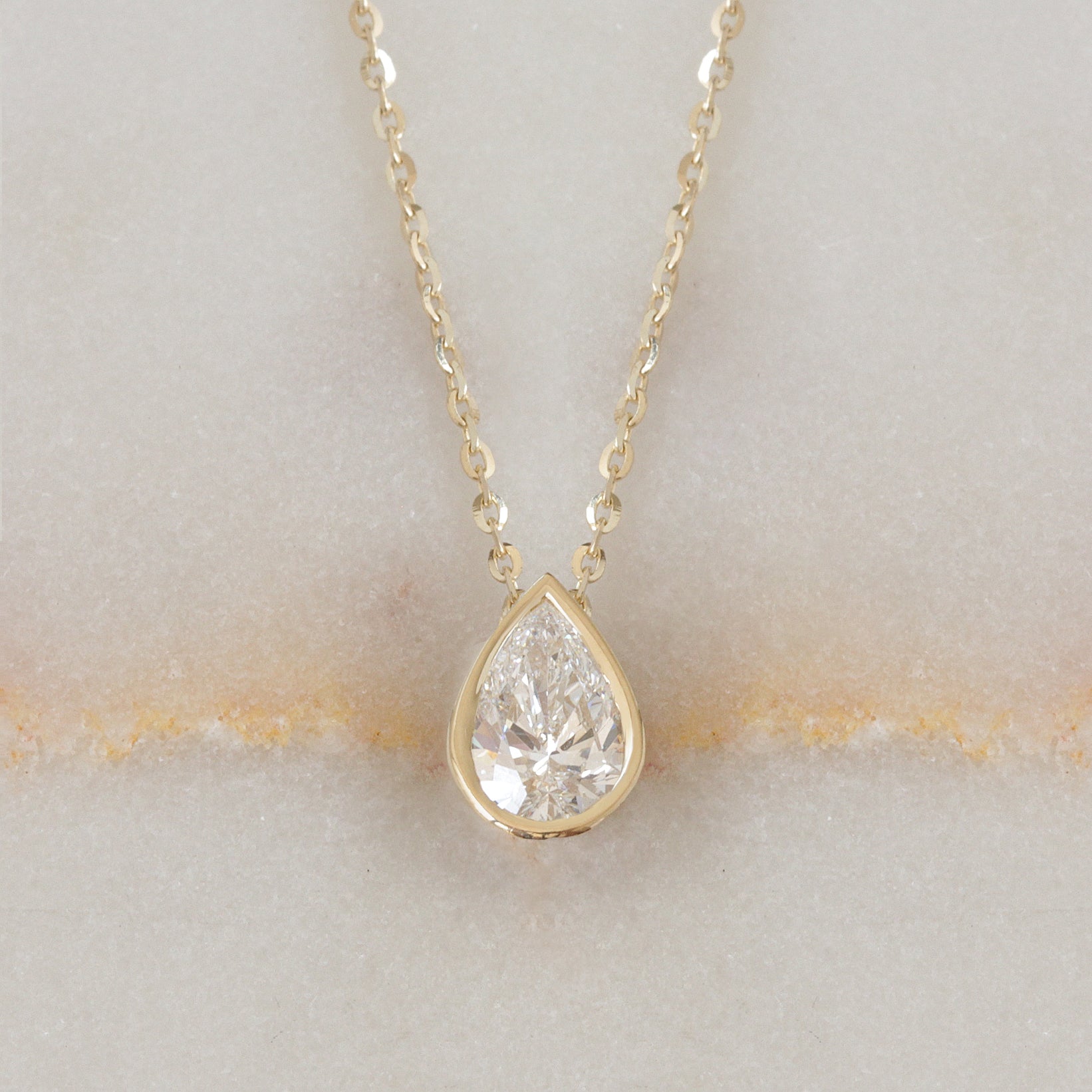 1ct pear shape diamond solitaire necklace bezel set