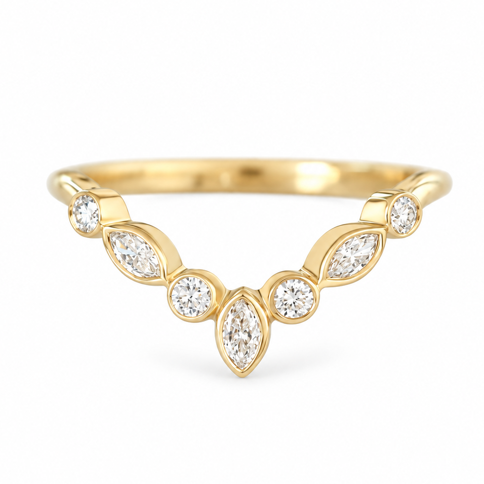A yellow gold ring featuring a curved row of marquise and round-cut clear gemstones, photographed on a clean white background.