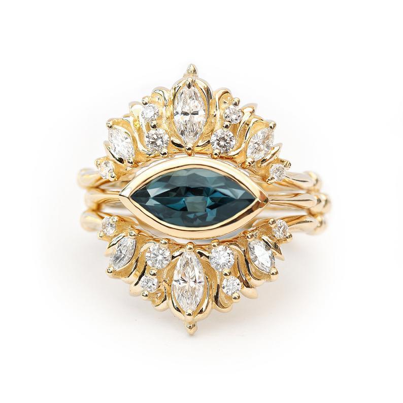 east west bezel set marquise 1ct london blue topaz and diamonds, three ring set