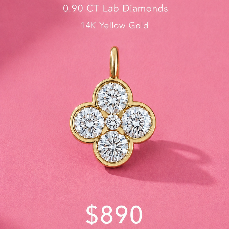 A clover-shaped pendant made of 14K yellow gold and four round lab-grown diamonds, displayed on a pink background with promotional text reading 'CLOVER DIAMOND PENDANT' and a '$890 instead of $1,405' offer.