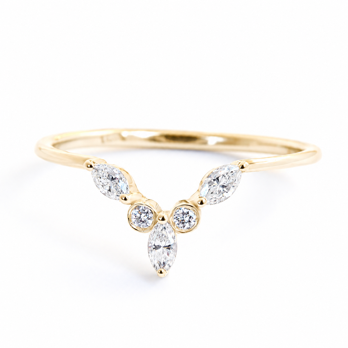A yellow gold Y-shaped ring featuring three marquise-cut diamonds and two round-cut diamonds, set against a clean white background.