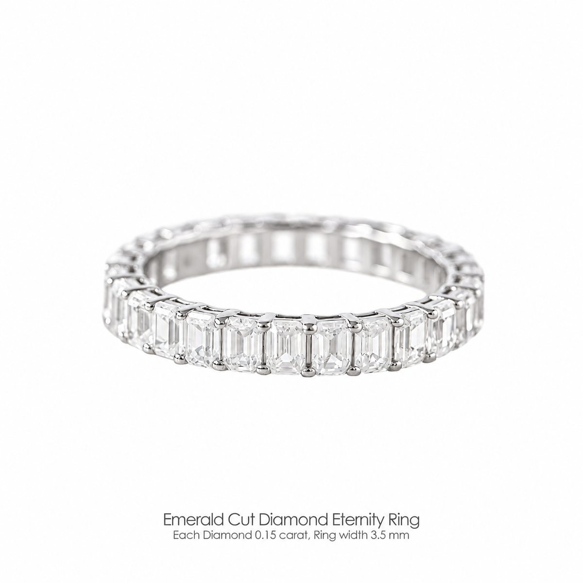 An emerald cut diamond eternity ring with a 3.1mm band width, each diamond is 0.10 carat, set in a white gold band.