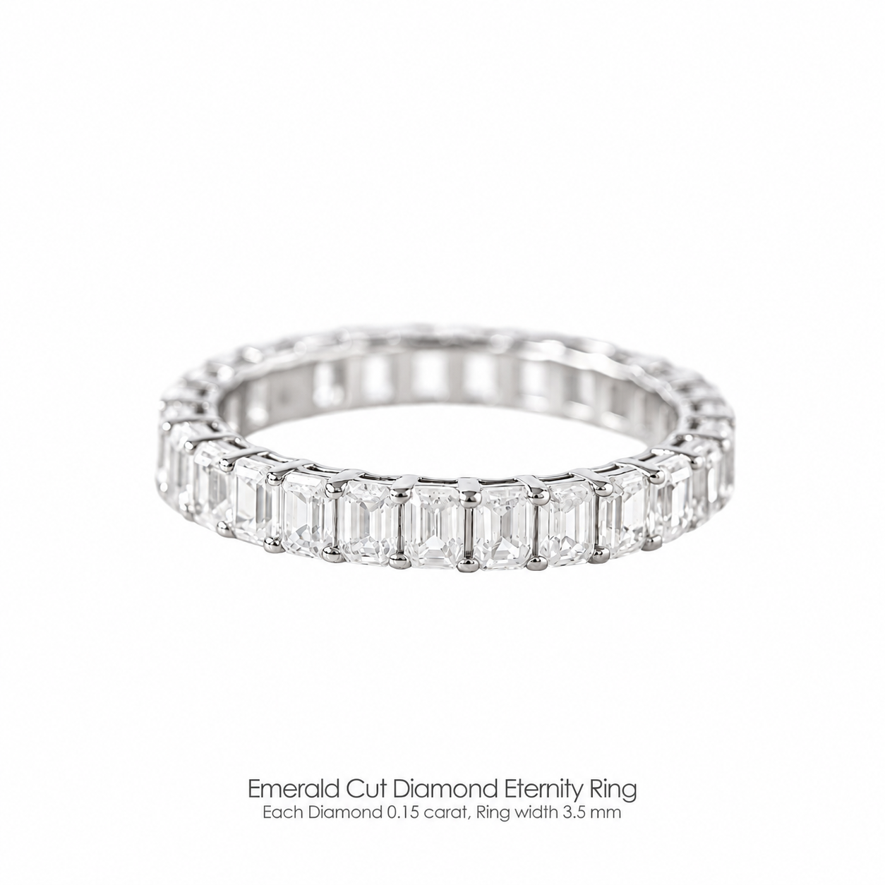 An emerald cut diamond eternity ring with a 3.1mm band width, each diamond is 0.10 carat, set in a white gold band.