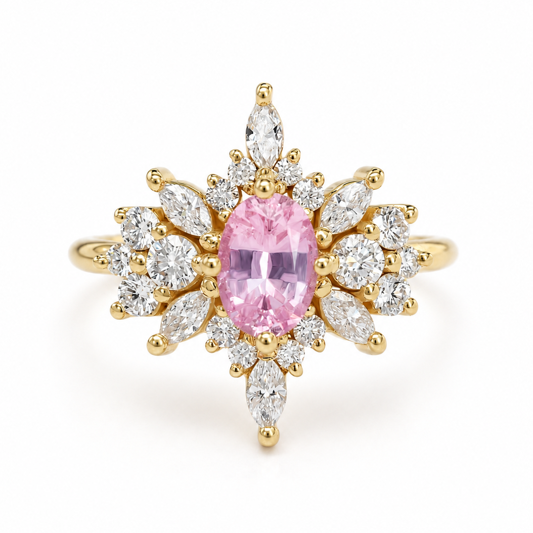 A yellow gold ring featuring a central oval pink gemstone surrounded by a radiant halo of marquise and round clear stones, set against a plain white background.