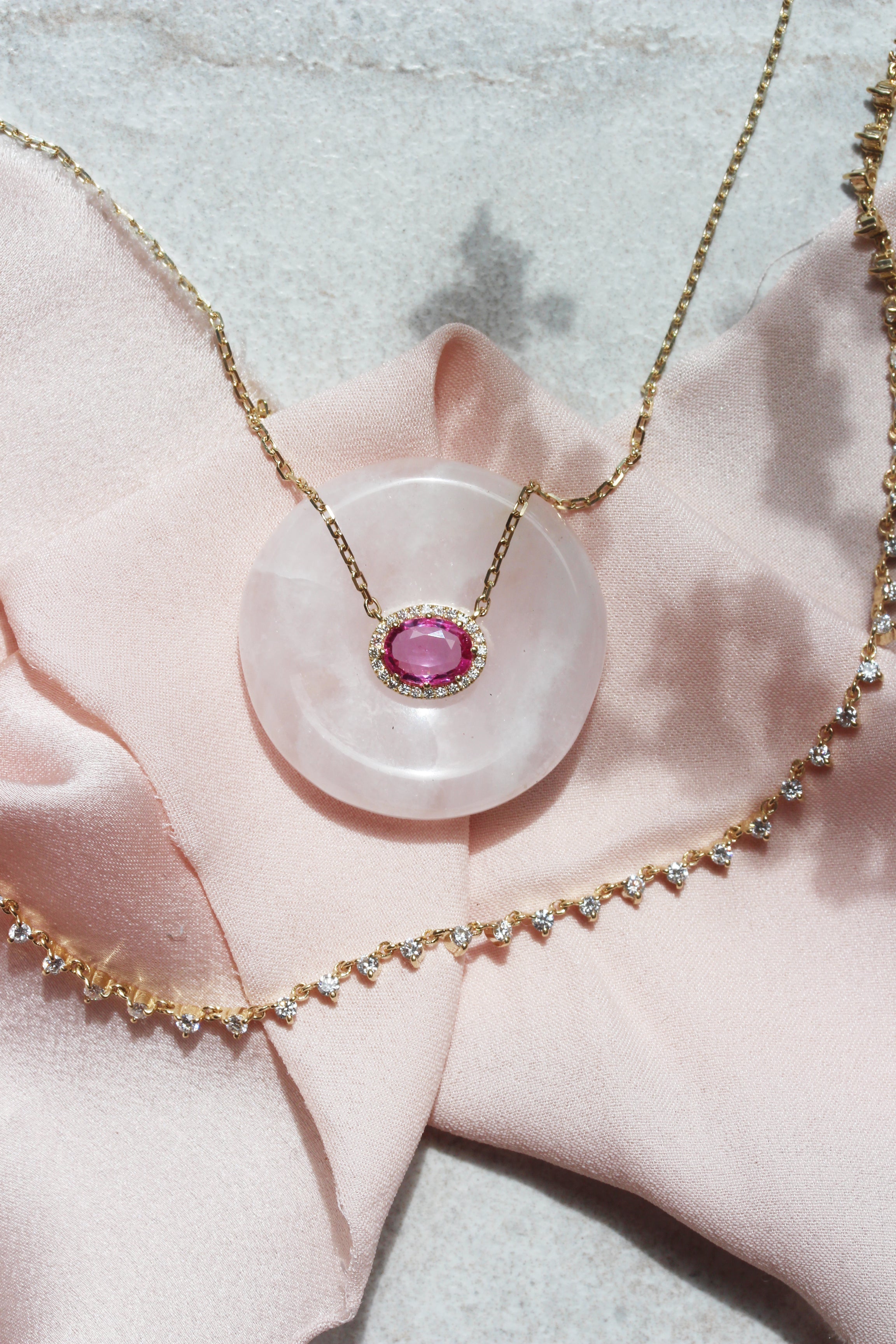 Oval Pink Sapphire and Diamond Halo Pendant Necklace