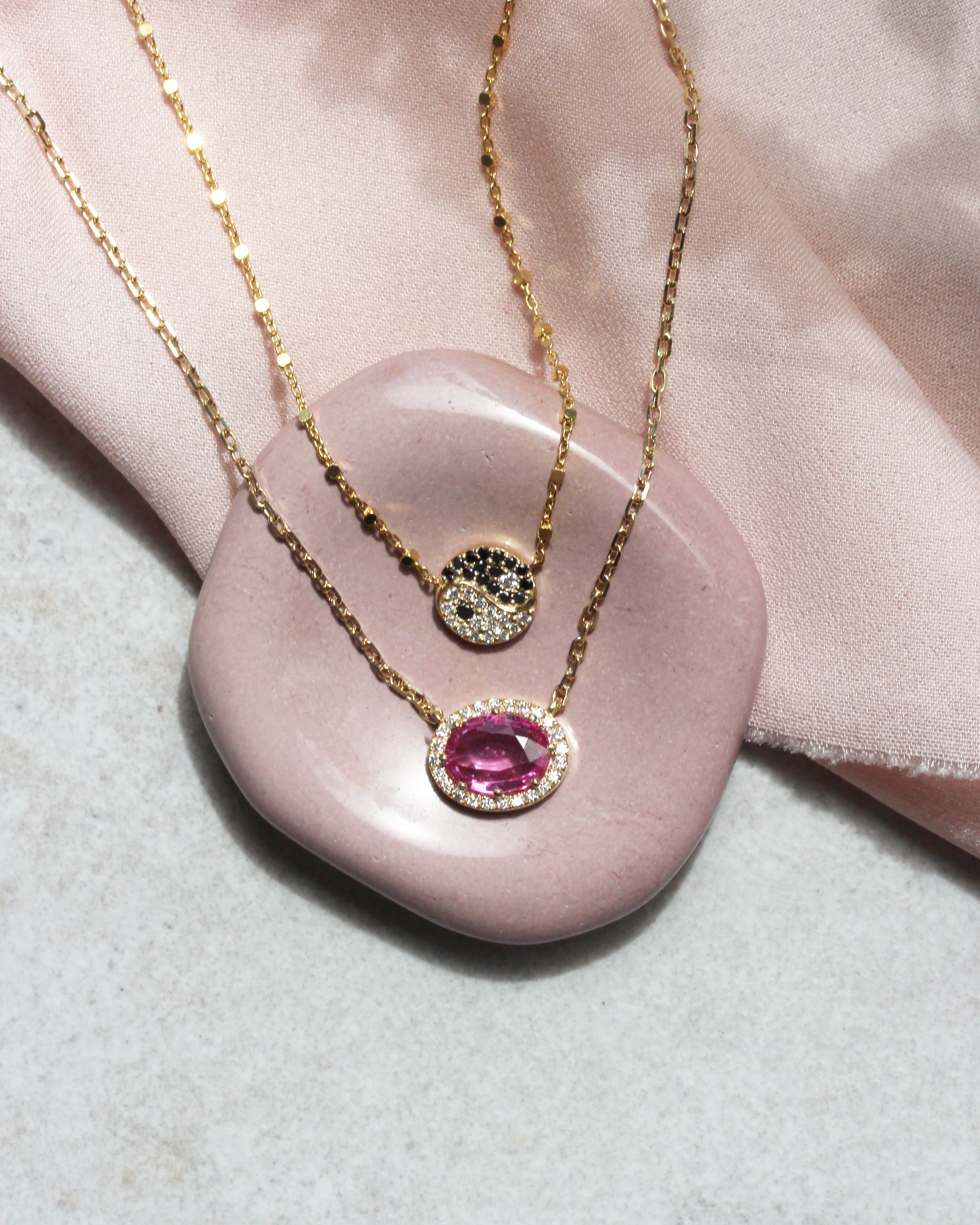 Oval Pink Sapphire and Diamond Halo Pendant Necklace