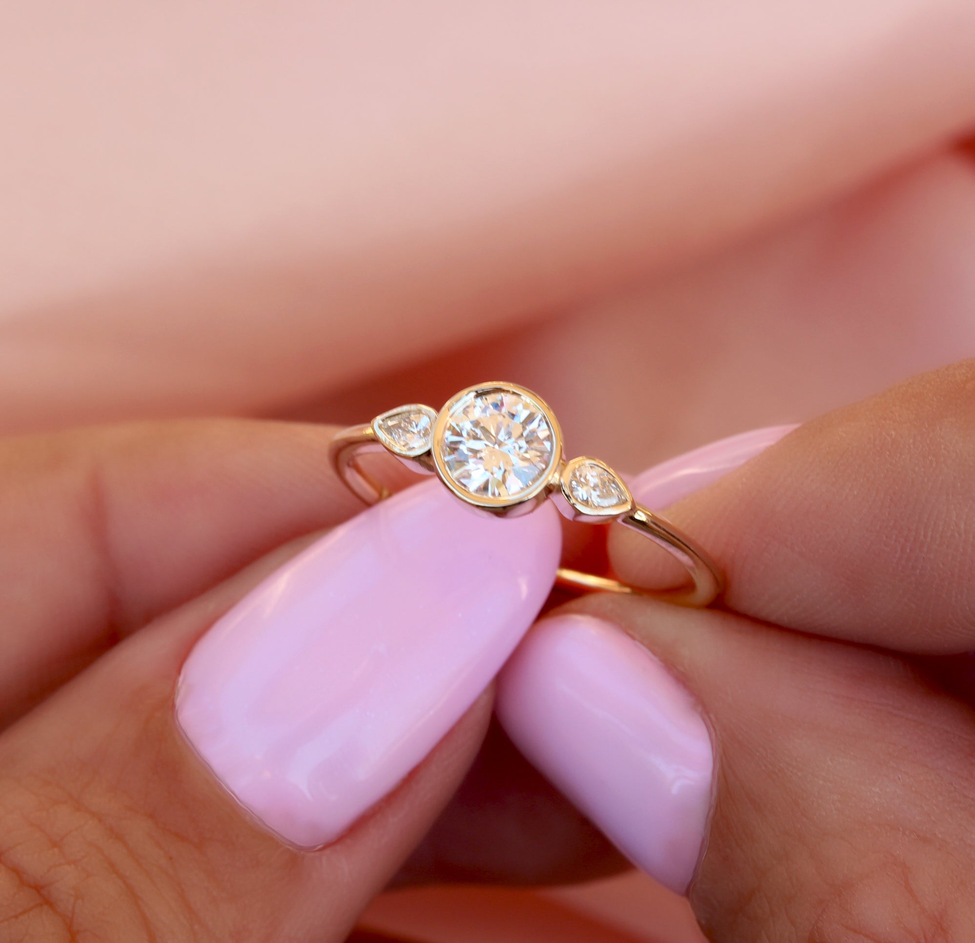 Three stone bezel engagement ring 