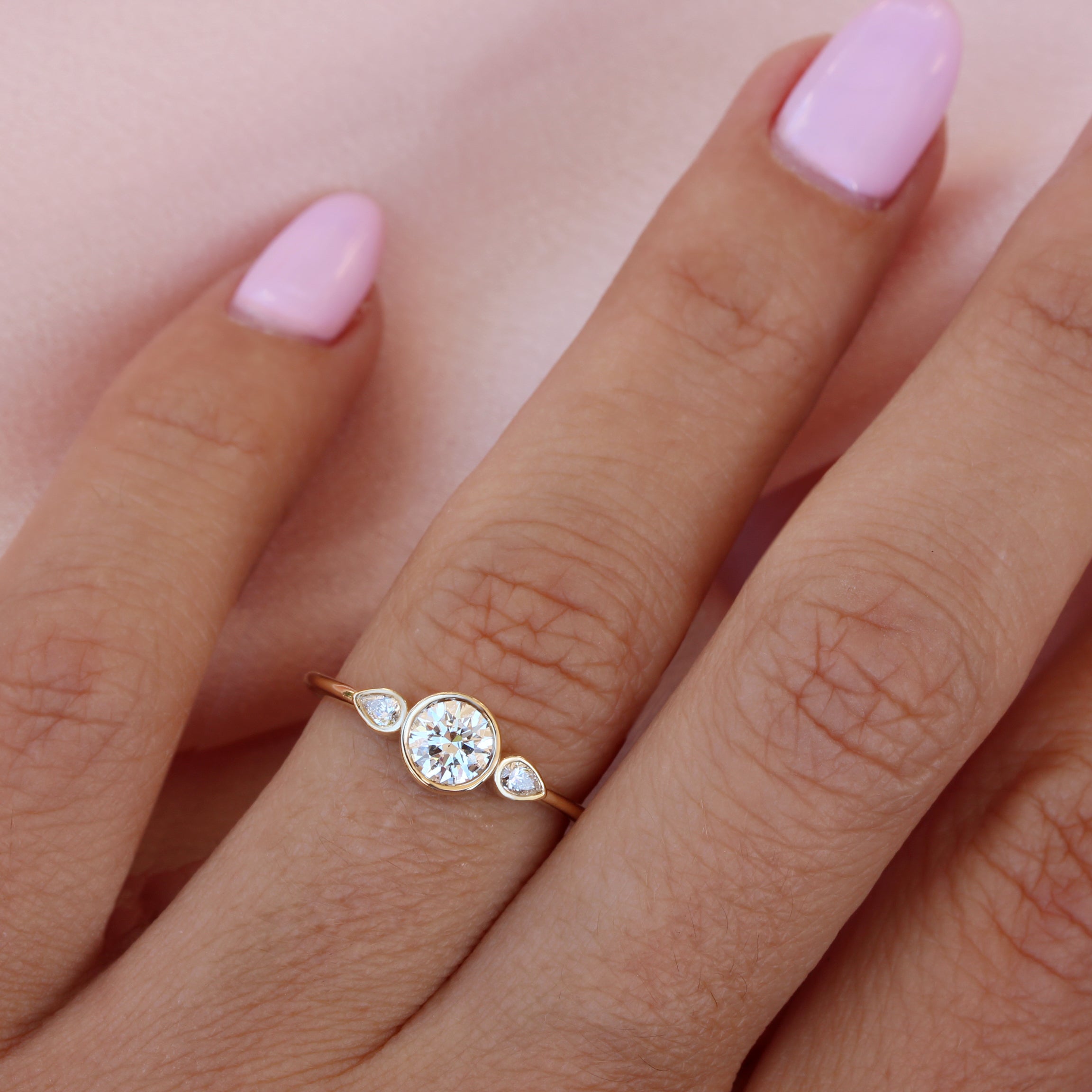 Three stone bezel engagement ring 