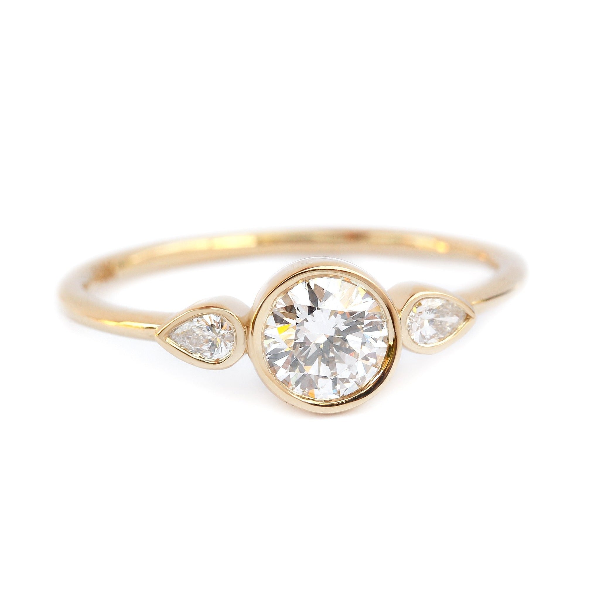 Three stone bezel engagement ring 