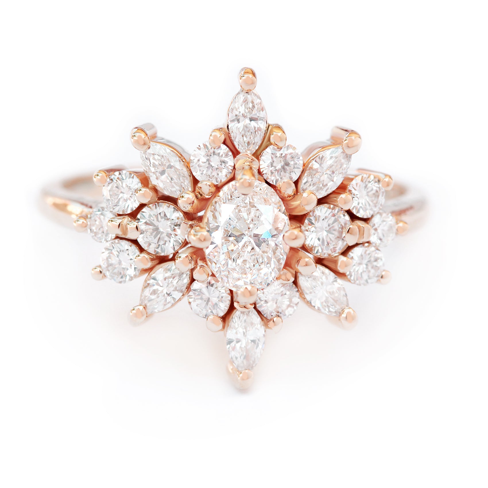 An engagement ring with a central oval diamond surrounded by smaller round and marquise shaped diamonds set in a gold band.